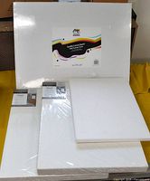 Front view of all four canvas boards showing sizes and packaging