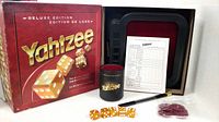 Full boxed set showing box, tray, dice cup, dice, score pad, pencil, chips