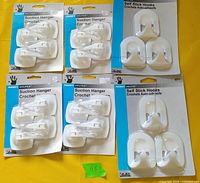 Six sealed Handy Helper hook packs displayed, showing product type and quantity