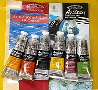 Front view of six paint tubes on colour chart