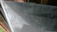 Front face of large slate panel showing dark grey surface scratches