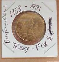 Reverse of Terry Fox $1 coin in holder