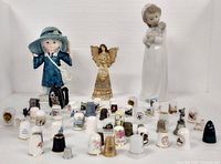 Group shot of all thimbles and three figurines
