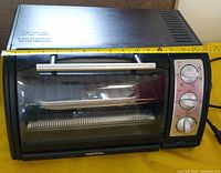 Front view of Toastess toaster oven showing size and controls