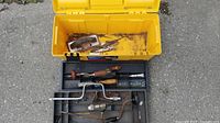 Open toolbox showing tray and hand tools