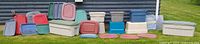 Wide view of all totes and lids lined against wall
