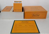 Box opened with white tray, question cards and instruction sheet visible