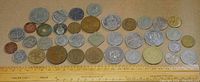 Full layout of all coins alongside a ruler for scale