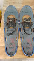 Full view of both Tubbs Vertex snowshoes