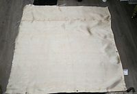 Full view of beige fiberglass welding blanket laid flat