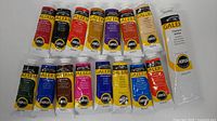 All 16 Winsor & Newton Galeria acrylic paint tubes laid out, showing sizes and colours