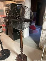 Full view of pedestal fan showing head, stand and base