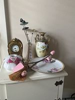 Group shot of all seven décor items on cabinet top