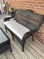 Loveseat with off-white cushion