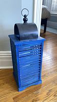 Front view blue wood lantern with metal top