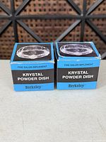 Front view of two boxed Berkeley Krystal Powder Dish units