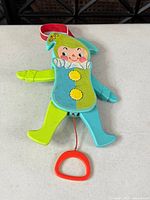 Front view of Fisher-Price Jolly Jumping Jack pull toy showing full figure and pull string