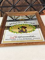 Full view of Liebfraumilch Rhine Bear mirror in wood frame