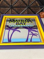 Front view showing full mirror sign, graphics, and frame colors