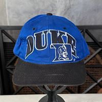 Front view showing DUKE wordmark, logo, black visor