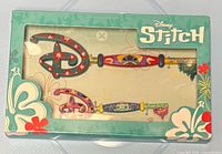 Front of sealed box showing two decorative key wall hooks