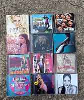 All 12 CD fronts laid out, showing artwork and titles