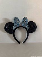 Front view of sequin mouse ear headband