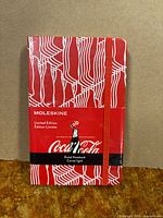 Front of sealed Moleskine Coca-Cola pocket notebook