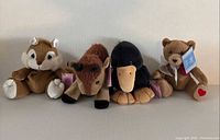 Group shot of all four Precious Moments plush animals