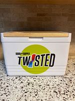 front view showing logo, body, wood lid