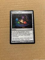 Front of Armillary Sphere card showing artwork, mana cost, card text, and light wear