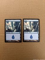 Front view of both Island cards side by side