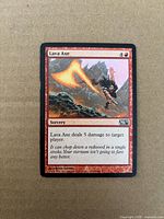 Front of Lava Axe card showing artwork, mana cost and set code