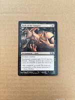 Front view of Mark of the Vampire card showing artwork, mana cost, text and visible edge wear