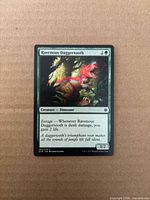 Front of Ravenous Daggertooth card displaying name, mana cost 2G, text box, power/toughness 3/2, collector number 202/279