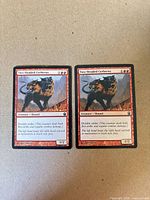 Front view of both Two-Headed Cerberus cards