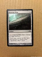 Front view of Razortip Whip card showing artwork, title, mana cost, type line and text box