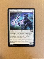 Front of Will-Forged Golem card