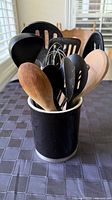 Utensils inside black ceramic holder
