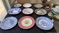 Group shot of all nine assorted porcelain plates
