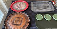 Overview showing four primary trays: red, glass, leather, green with coasters
