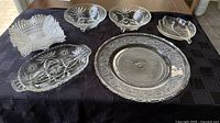 Group shot of all pressed glass pieces on cloth