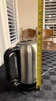Full height view of kettle beside tape measure