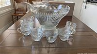 complete punch bowl set with pedestal and cups displayed