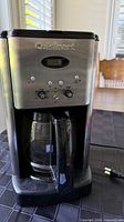 Front view of Cuisinart coffee maker showing controls and attached carafe