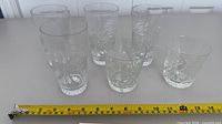 All six glasses lined up with tape measure for scale