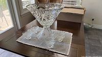 punch bowl on pedestal with six of eight cups visible
