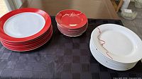 Stacks of three plate types: dinner, salad, dessert
