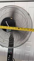 Front view showing full fan with grille, stand and base