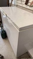 Side and top view of closed freezer showing overall exterior condition